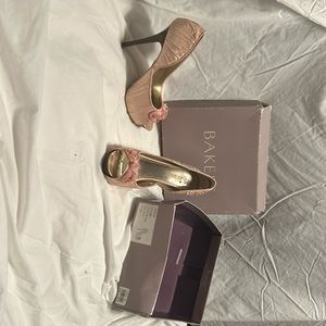 Bakers, Sandie, 24 pale pink satin. All diamond embellishments are attached